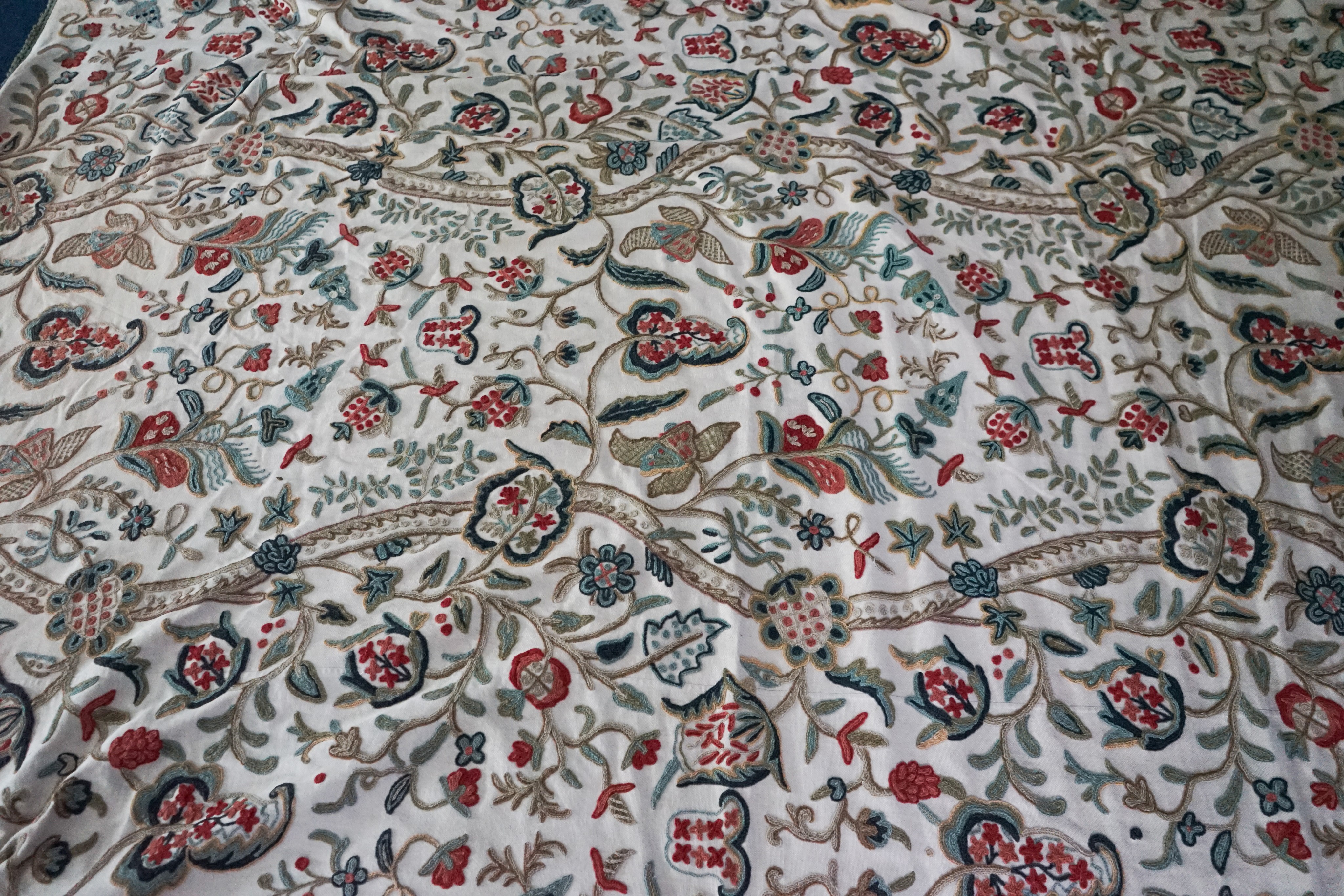 A Chelsea Textiles crewel work double bed spread, 550 x 260cm